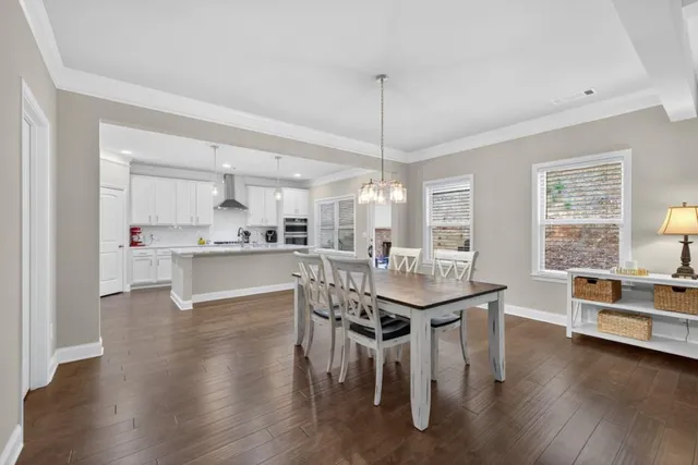 a bathroom with a granite countertop sink and a toilet