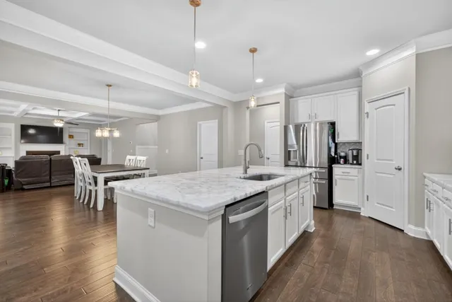 a view of a livingroom with furniture and a window
