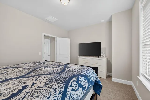 a white toilet sitting next to a shower curtain