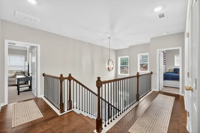 a spacious bedroom with a bed and furniture