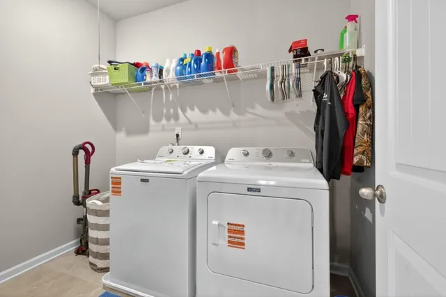 a bathroom with a double vanity sink a large mirror and shower