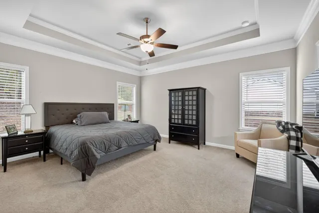 an aerial view of a house with a lake view