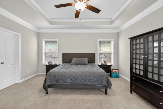 an aerial view of a house with a lake view