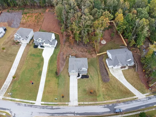 a view of a house with backyard porch and sitting area