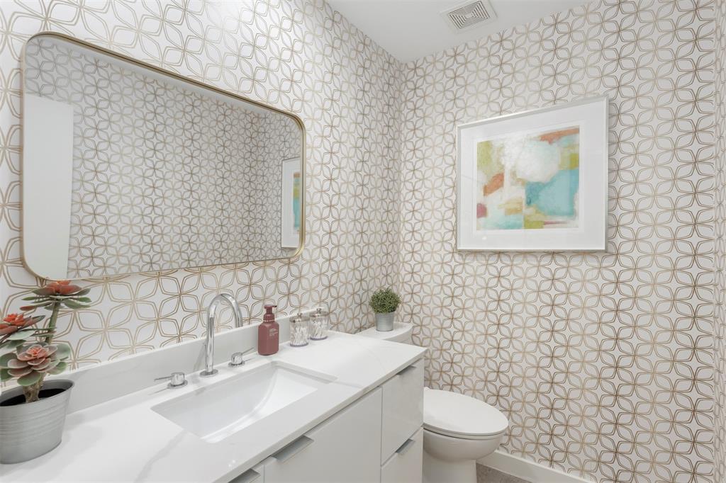 5100 Verde Valley Lane, Unit 135 Dallas, TX 75254 - Photo 11 of 26 Updated with quartz countertop, newer cabinets, wallpaper and mirror