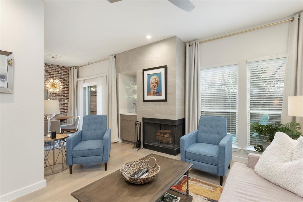 5100 Verde Valley Lane, Unit 135 Dallas, TX 75254 - Photo 2 of 26 Bright with natural light and an updated tiled fireplace