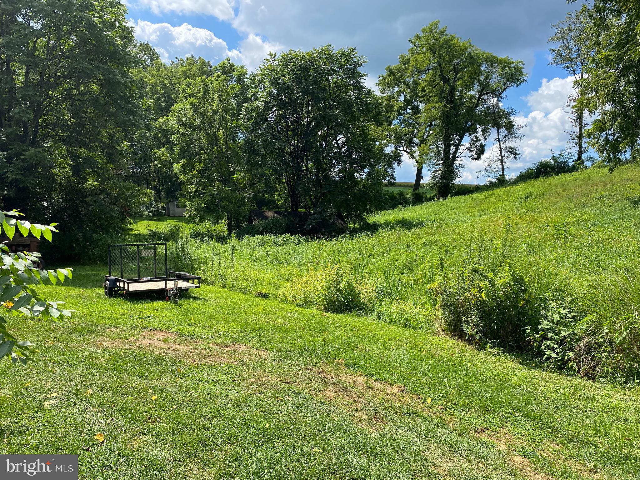 10400 Enfield Road Felton, PA 17322 - Photo 22 of 36 a view of a backyard with a garden