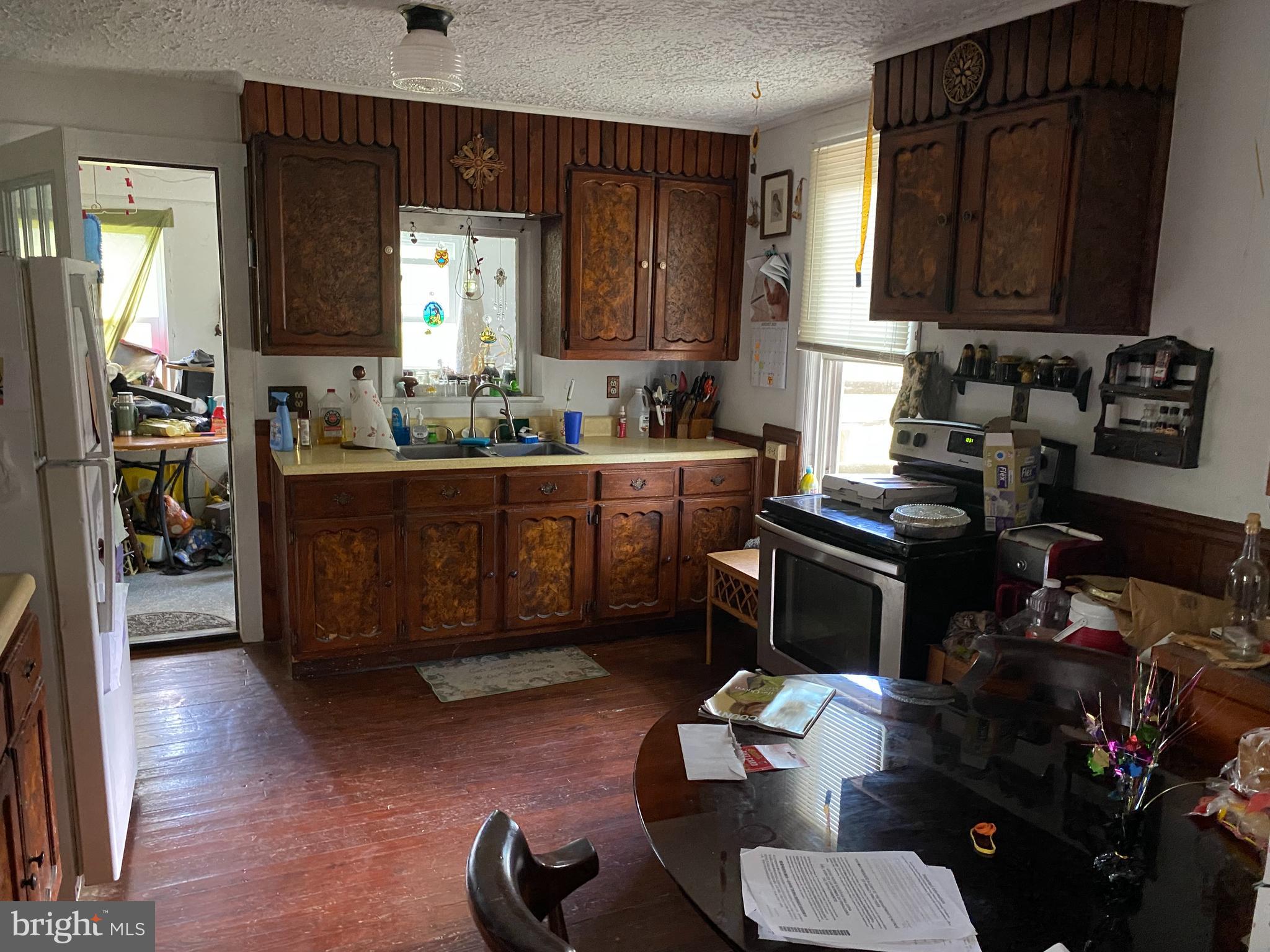 10400 Enfield Road Felton, PA 17322 - Photo 23 of 36 a kitchen with a refrigerator and a stove top oven