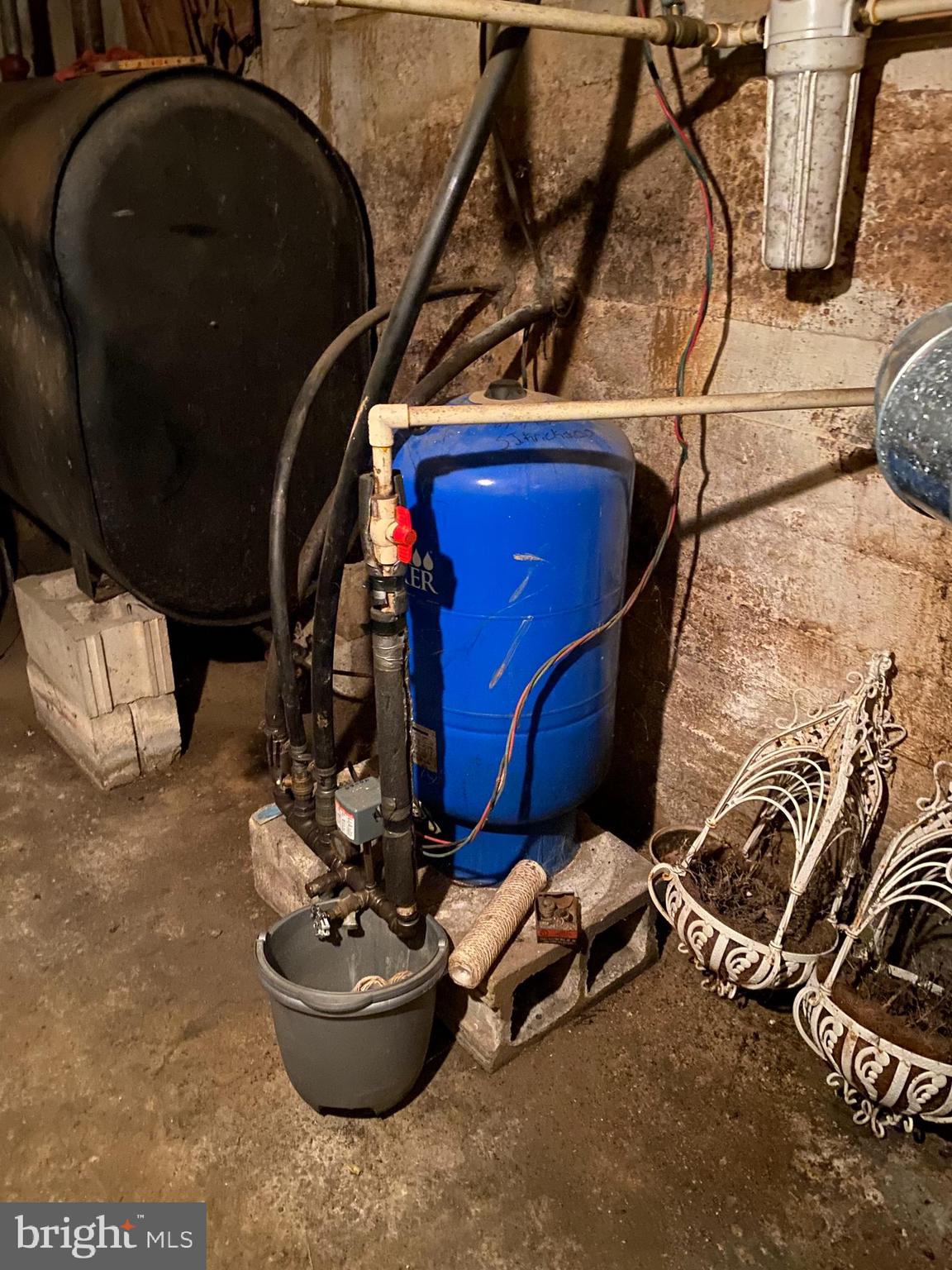 10400 Enfield Road Felton, PA 17322 - Photo 35 of 36 a room with water heater and wooden floor