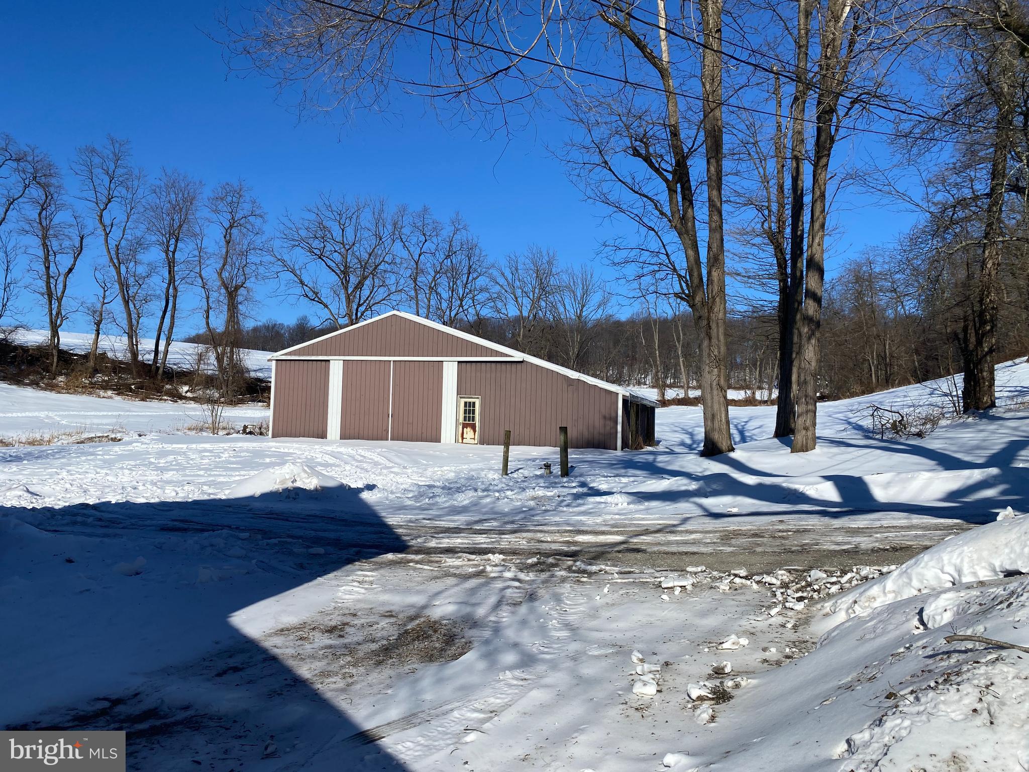 10400 Enfield Road Felton, PA 17322 - Photo 7 of 36 a view of a house with a snow on the road