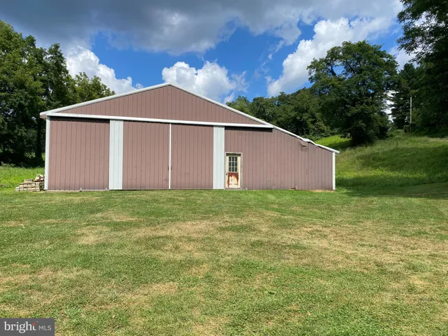 a view of a backyard of the house