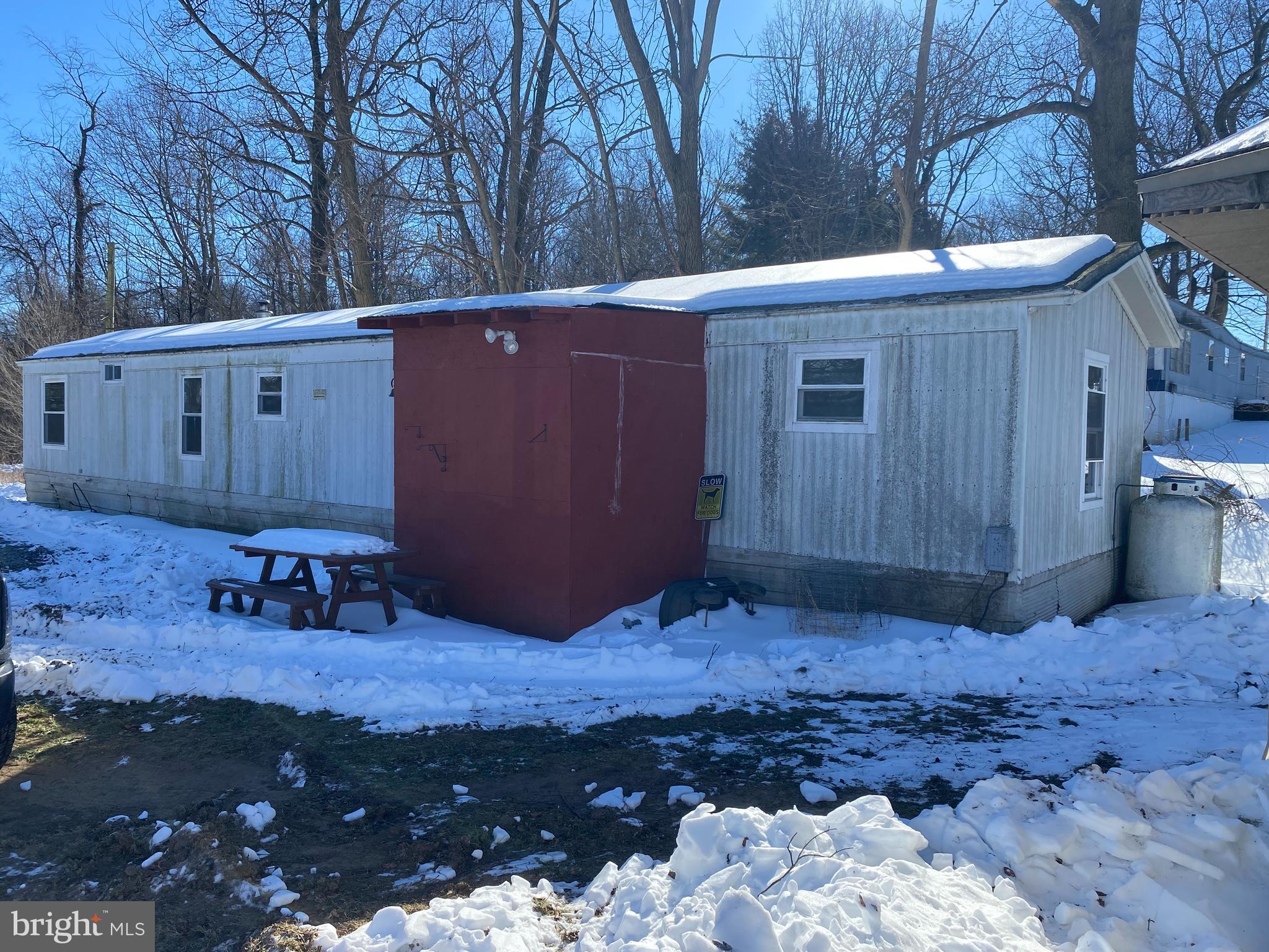 10400 Enfield Road Felton, PA 17322 - Photo 9 of 36 a view of backyard with wooden fence and large trees