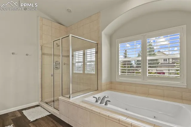 a bathroom with a tub and a sink