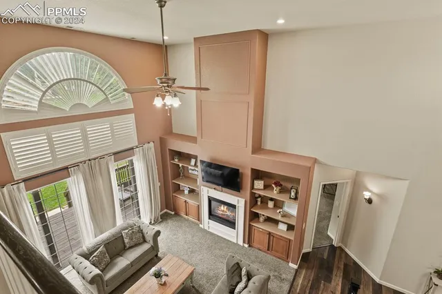 a view of hall way with furniture and a window