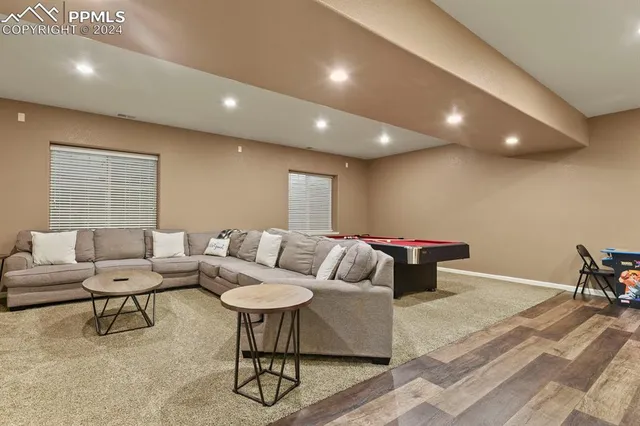 a living room with furniture and a table