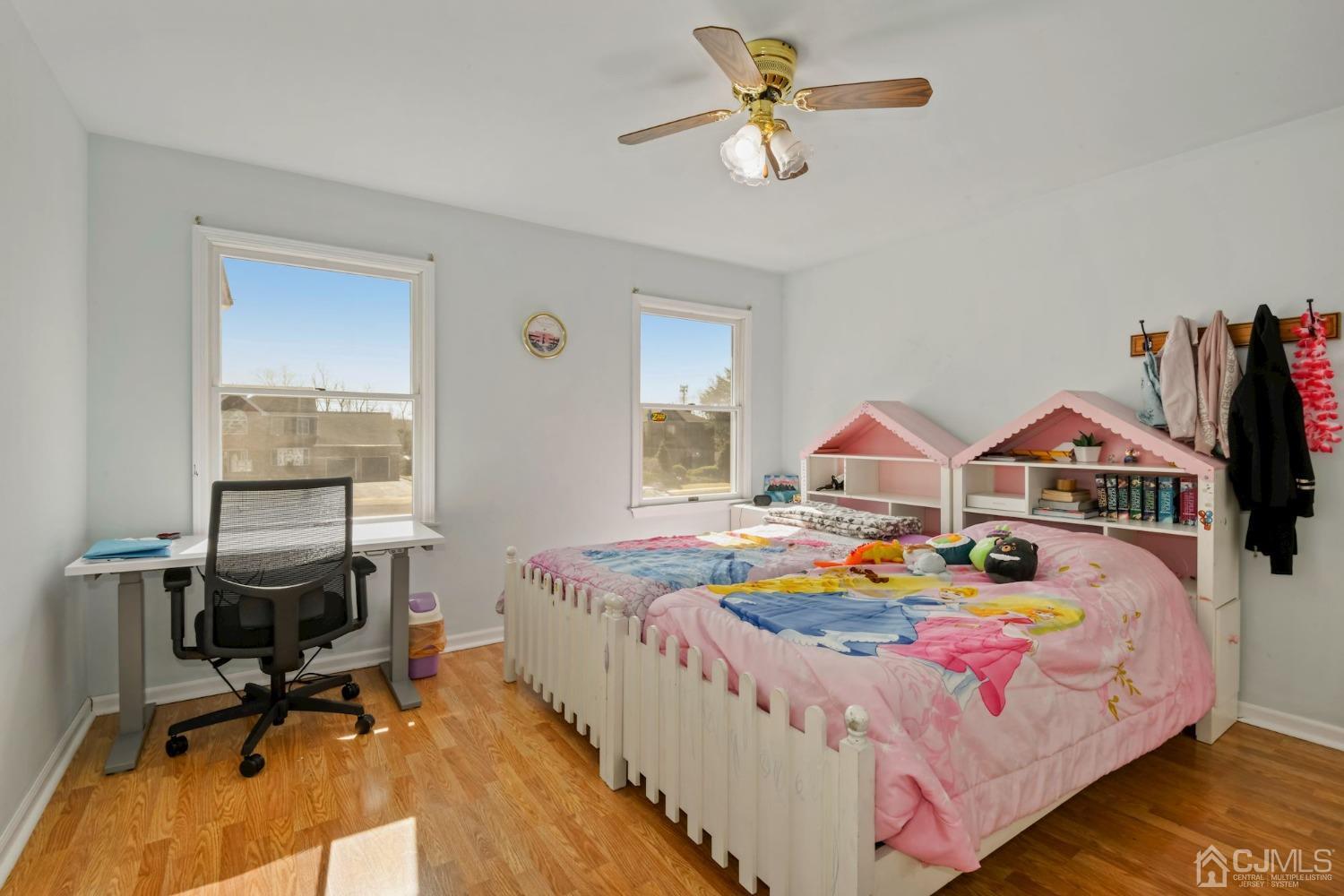 16 Allison Court Edison, NJ 08820 - Photo 17 of 33 a bedroom with a bed a table and a chandelier