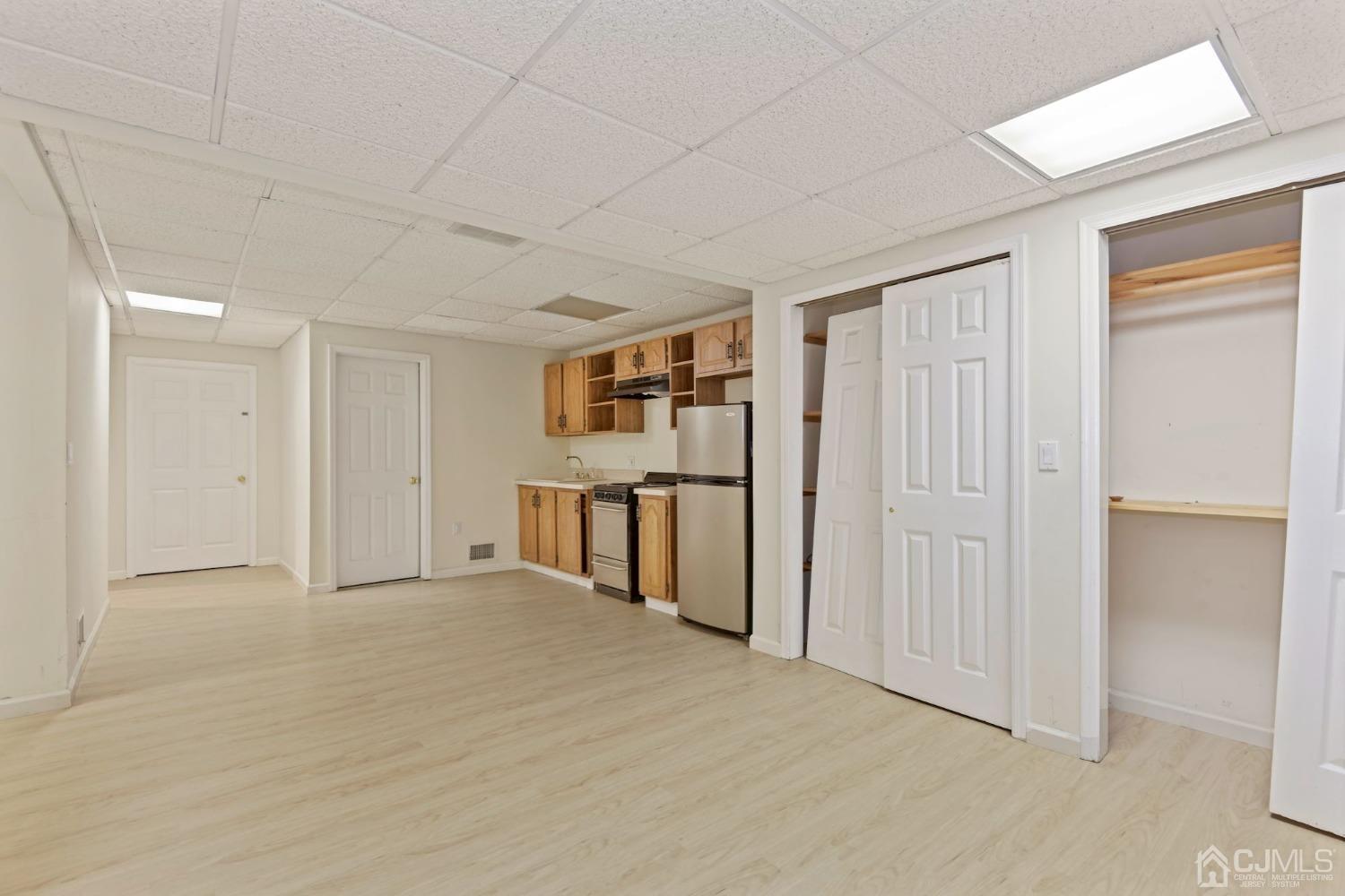 16 Allison Court Edison, NJ 08820 - Photo 26 of 33 a view of an empty room with wooden floor and a window