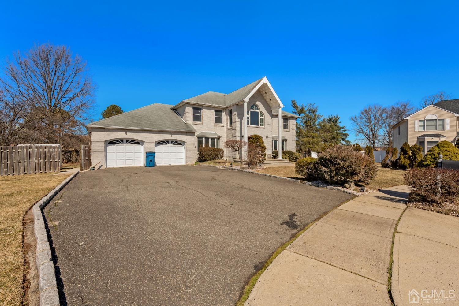 16 Allison Court Edison, NJ 08820 - Photo 3 of 33 a front view of a house with a yard