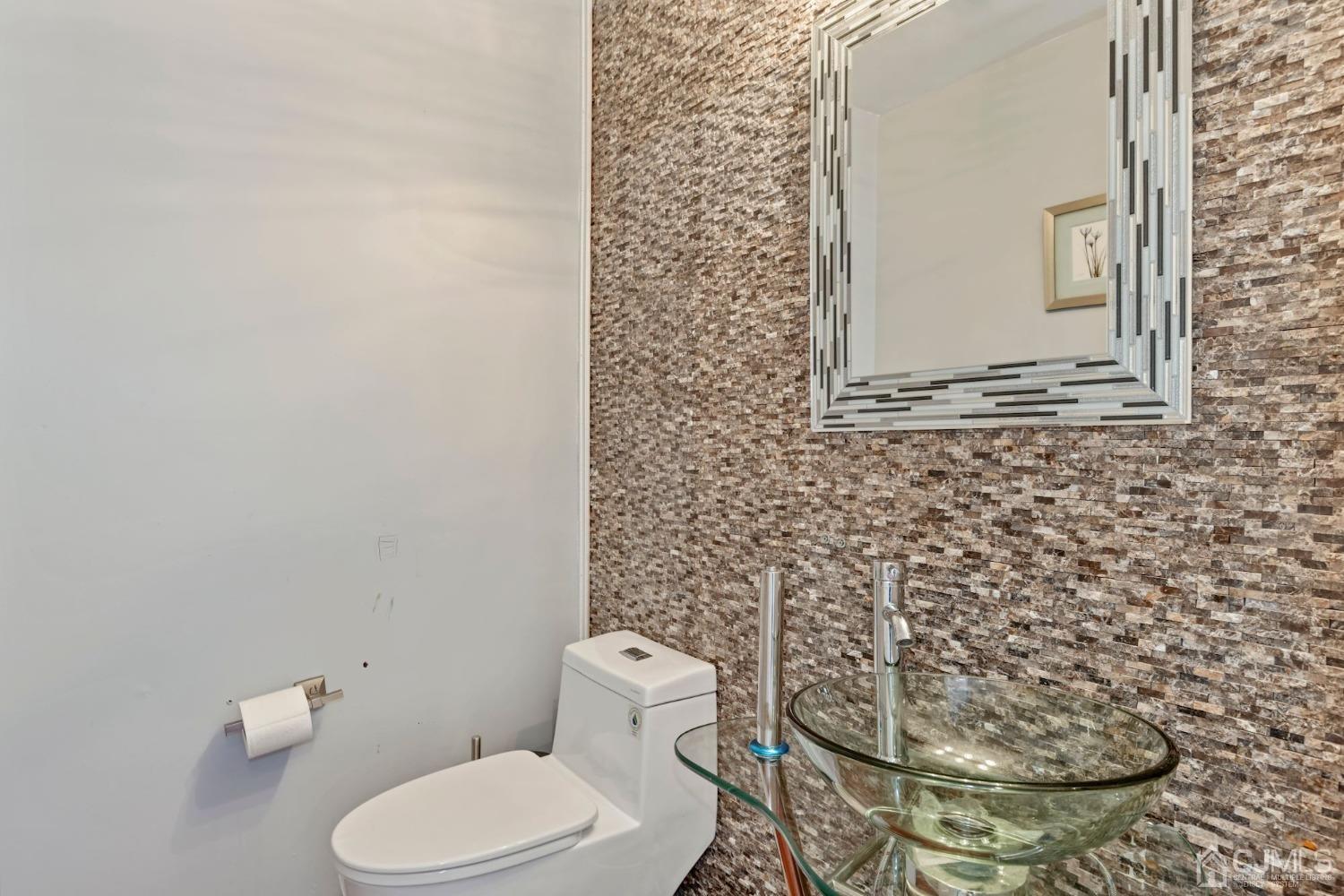 16 Allison Court Edison, NJ 08820 - Photo 6 of 33 a white toilet sitting next to a shower curtain