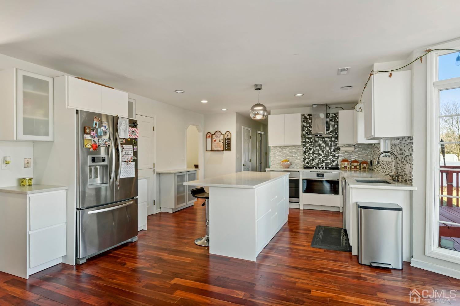 16 Allison Court Edison, NJ 08820 - Photo 10 of 33 a kitchen with stainless steel appliances a refrigerator sink and stove
