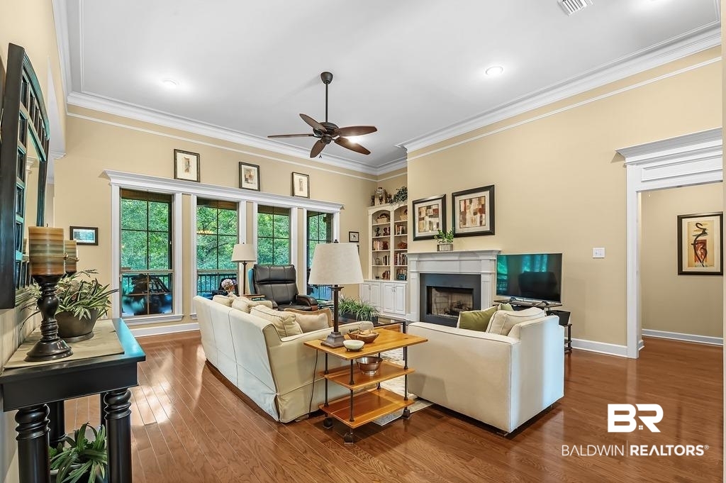 29976 Dolive Ridge Daphne, AL 36527 - Photo 17 of 58 Living room with ornamental molding, ceiling fan, and hardwood / wood-style floors