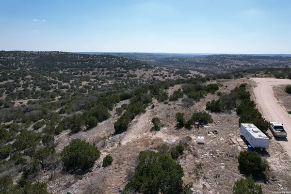 a view of a dry yard covered with snow