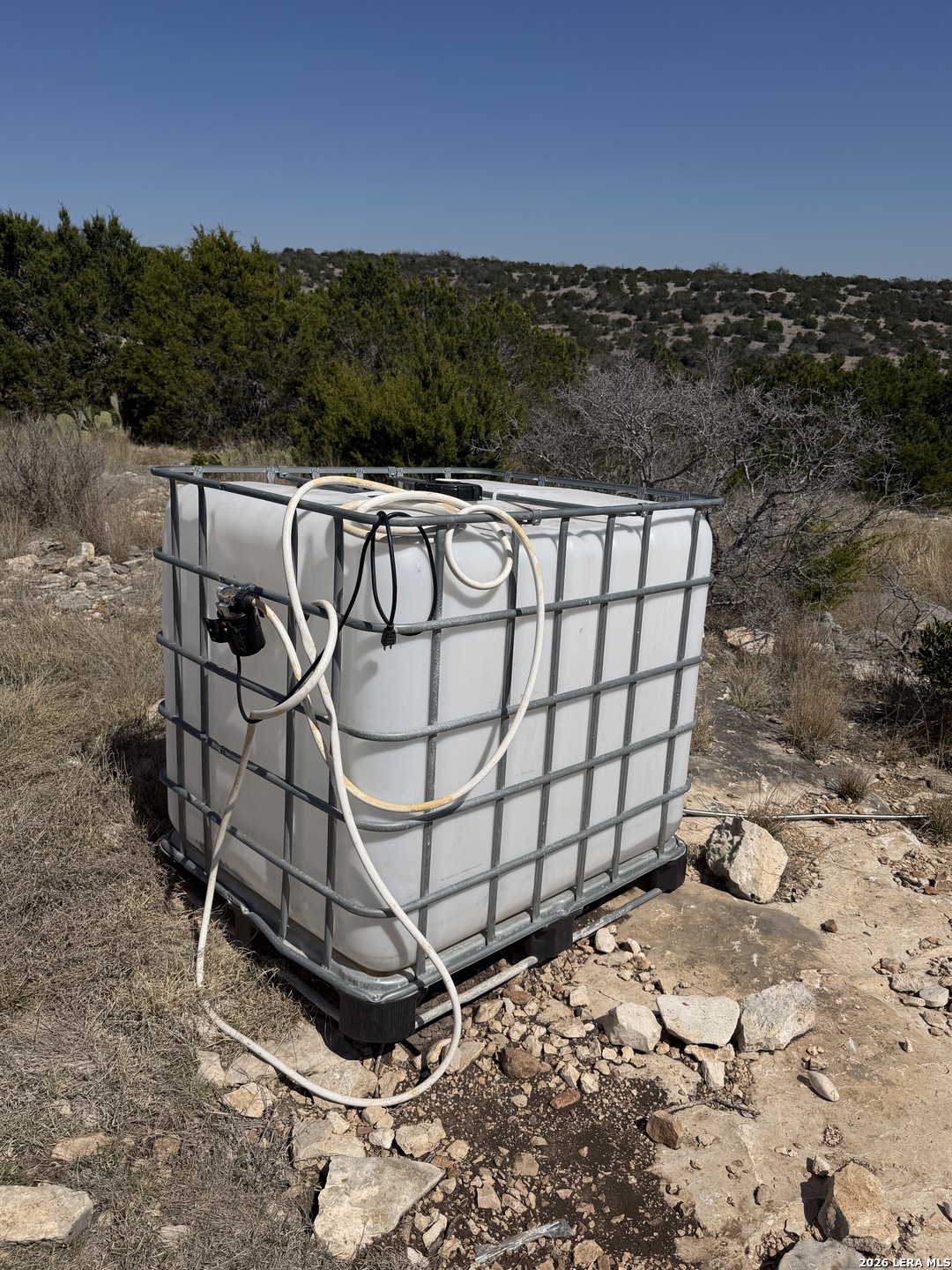 1213 SD 42200 Rocksprings, TX 78880 - Photo 31 of 33 a view of a backyard with wooden fence