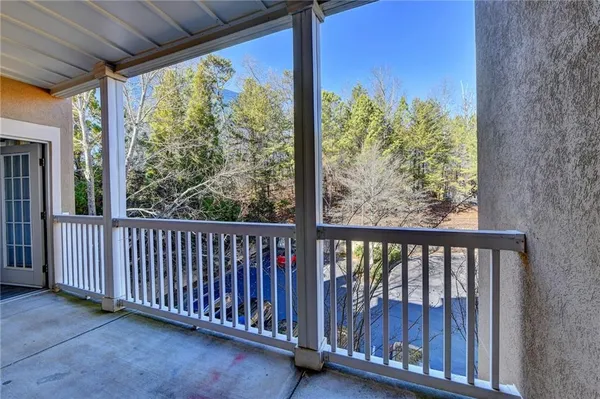 a view of a porch with a floor to ceiling window