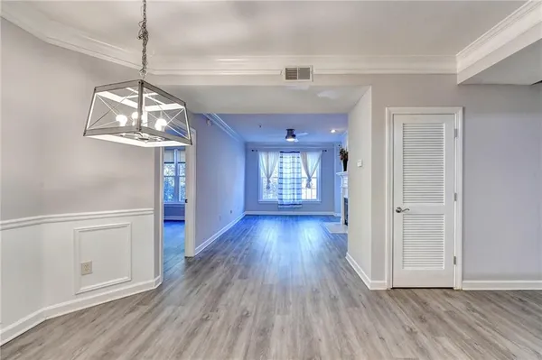 a view interior of a house wooden floor door and a window