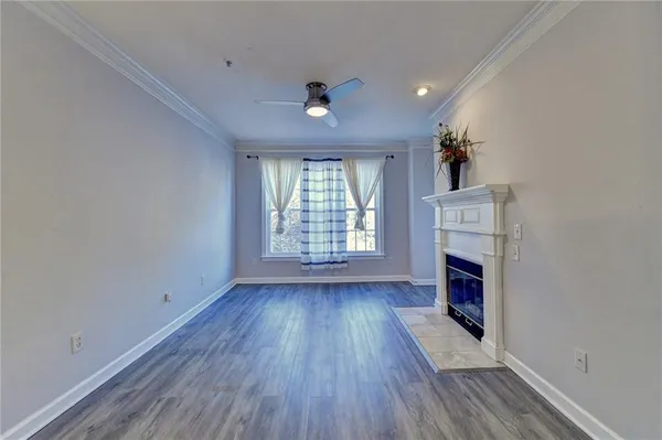 wooden floor in an empty room with a fireplace