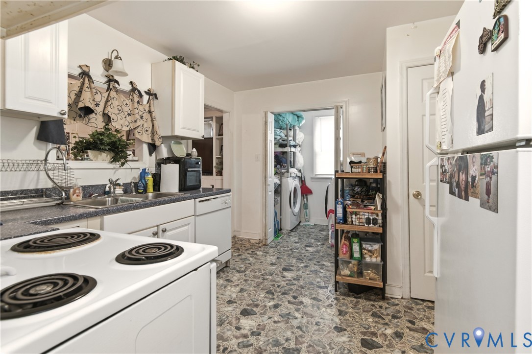 1311 Williamsburg Road Richmond, VA 23231 - Photo 15 of 38 Kitchen featuring white cabinetry, a dual-basin si