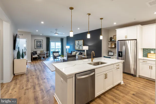 a large kitchen with stainless steel appliances kitchen island a large island in the center