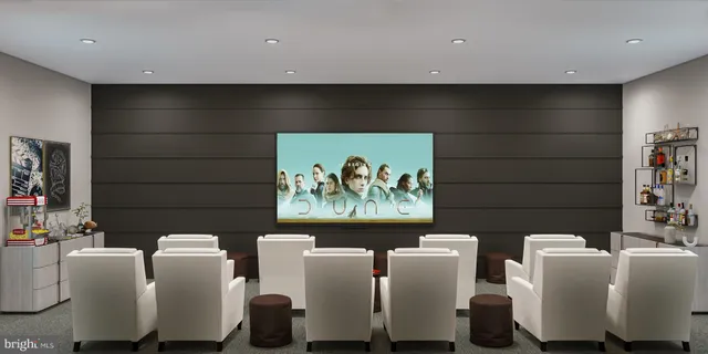 a living room with furniture and wall paintings