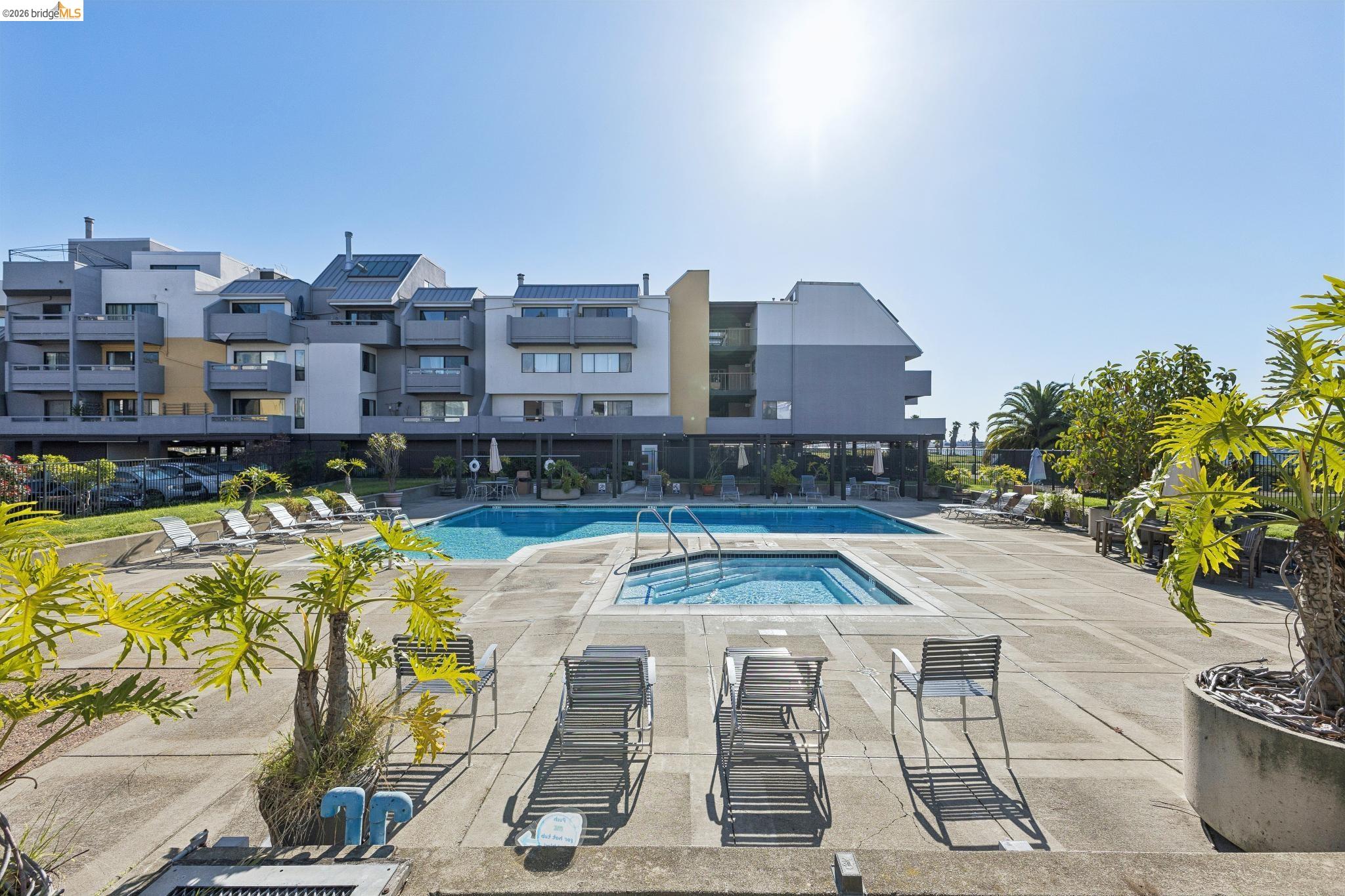 5 Embarcadero, Unit 129 Oakland, CA 94607 - Photo 25 of 32 Community pool with a community hot tub, sauna, changing room and a patio area