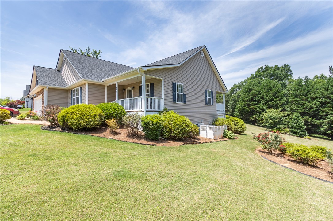 861 North Old Pendleton Road Liberty, SC 29657 - Photo 44 of 45 A welcoming front porch enhances this home's curb appeal, set amidst a well-maintained lawn and verdant landscaping.