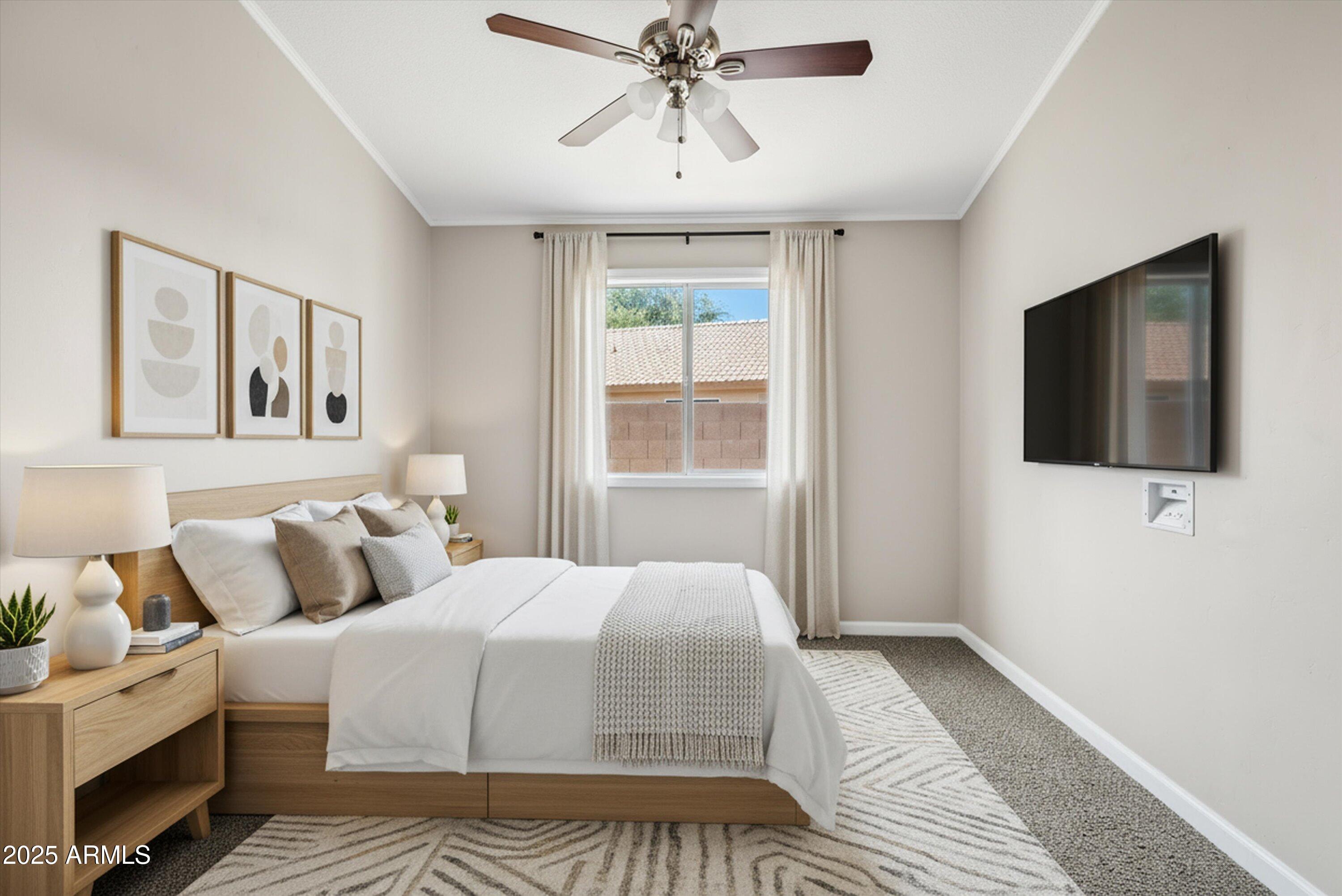 545 South Ash Street Gilbert, AZ 85233 - Photo 20 of 38 a bedroom with a large bed and a flat tv screen