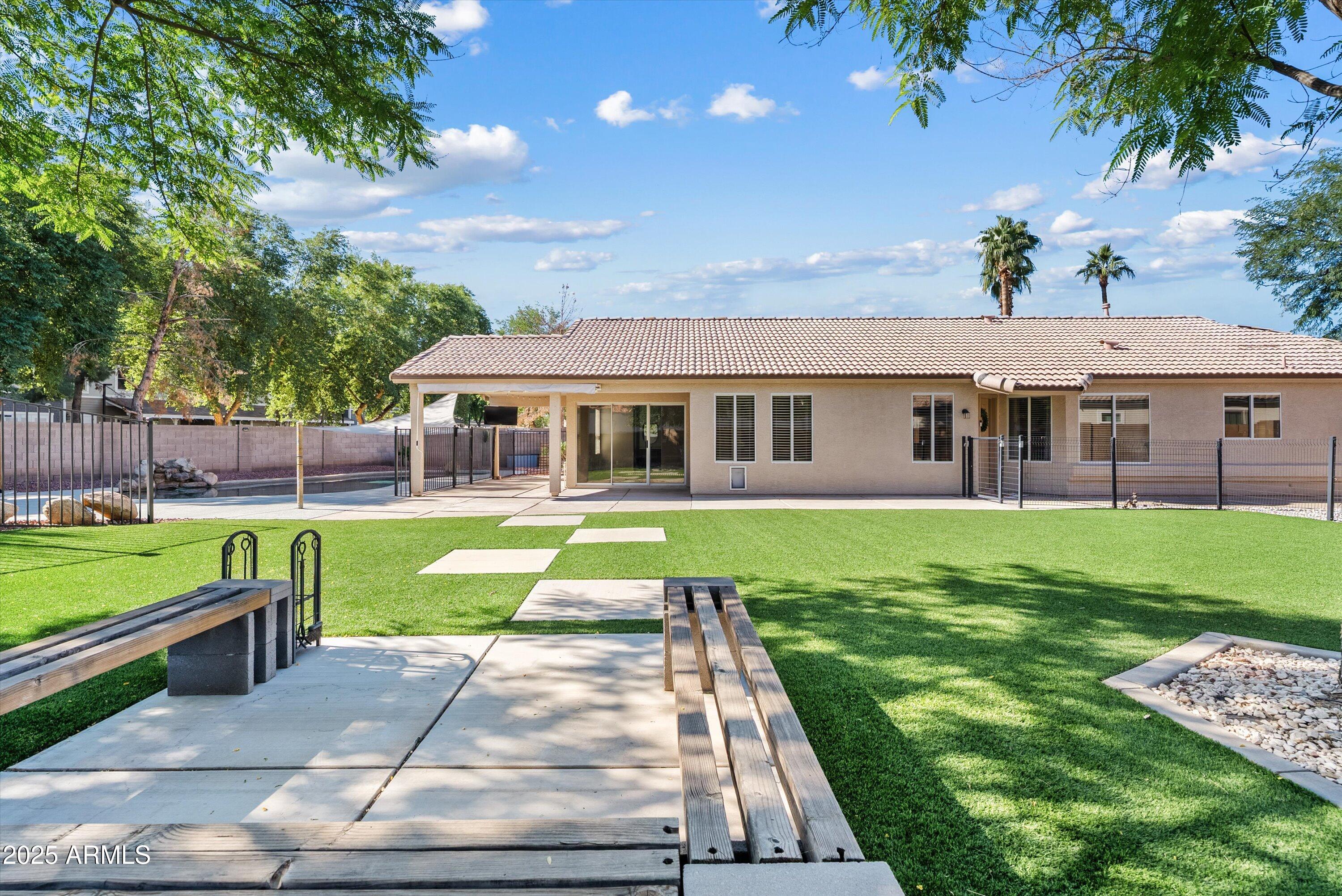 545 South Ash Street Gilbert, AZ 85233 - Photo 27 of 38 a view of a house with a yard