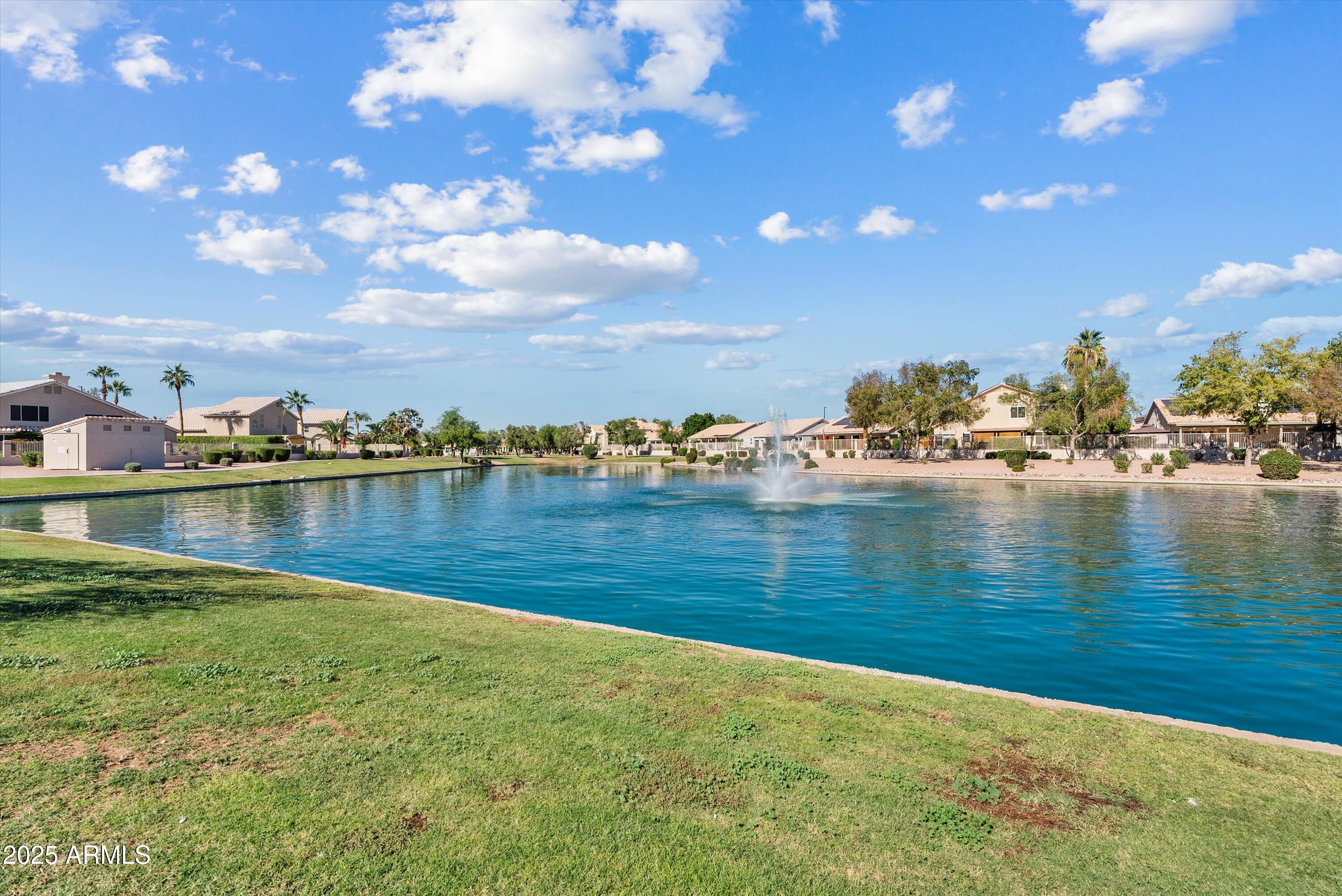 545 South Ash Street Gilbert, AZ 85233 - Photo 34 of 38 a view of a lake with houses in the background