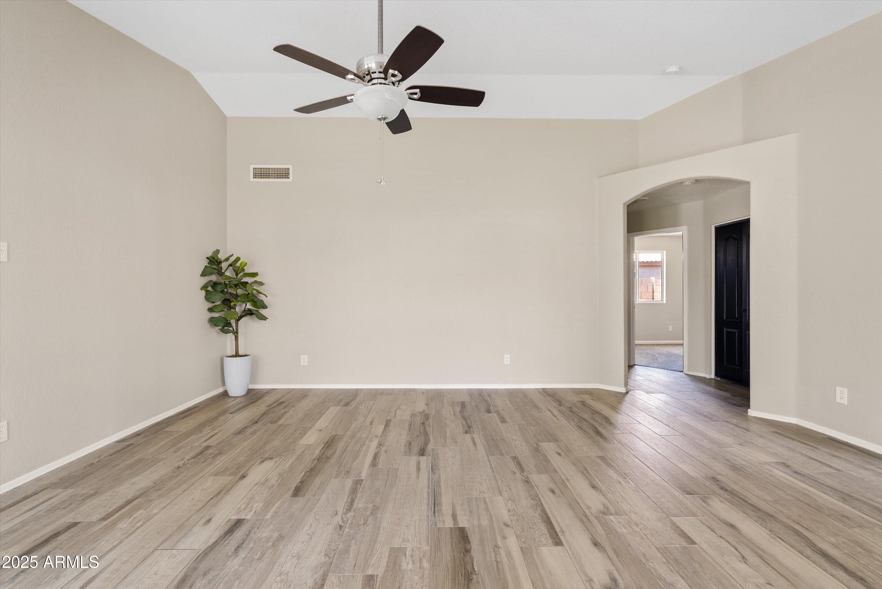 545 South Ash Street Gilbert, AZ 85233 - Photo 3 of 38 a view of an empty room with wooden floor