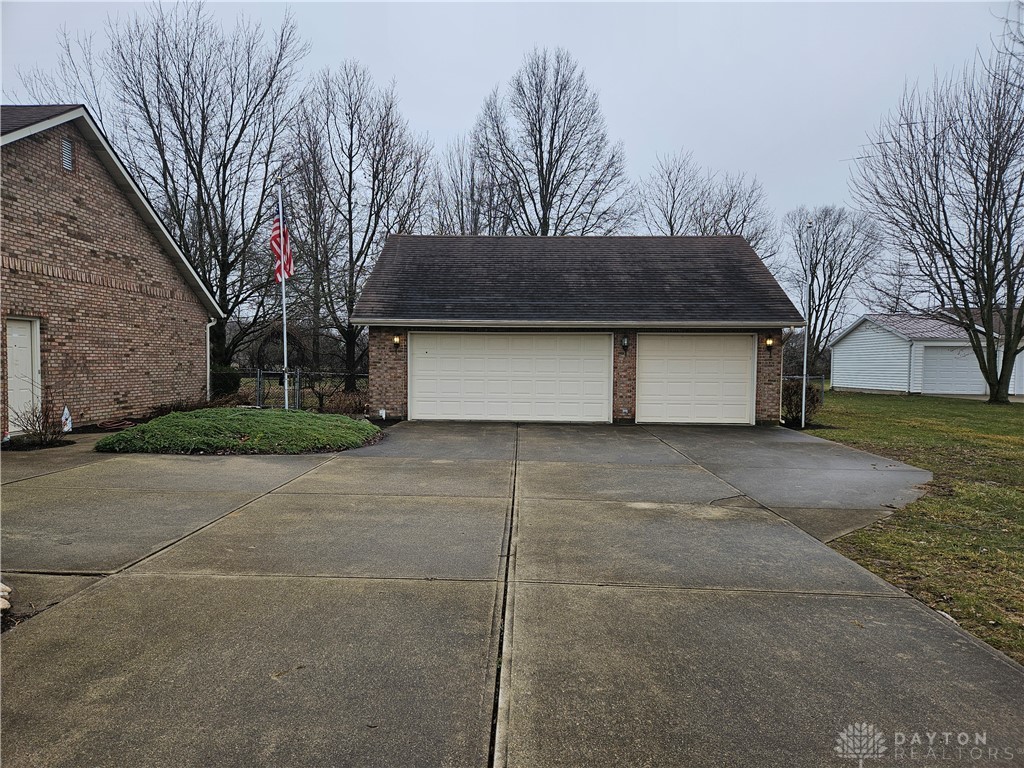 4909 Shannon Avenue Springfield, OH 45504 - Photo 3 of 21 This property features a spacious detached garage with dual doors and a broad concrete driveway.