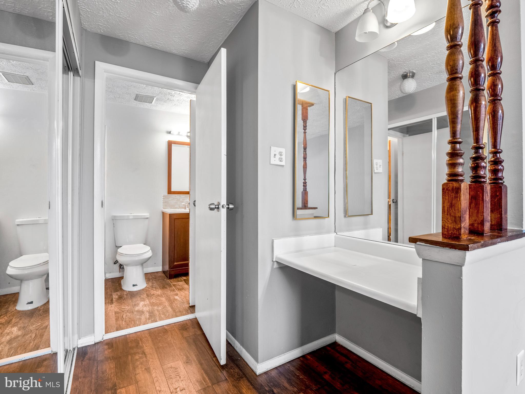 8315 Brookvale Court Springfield, VA 22153 - Photo 16 of 24 a bathroom with a sink and a mirror