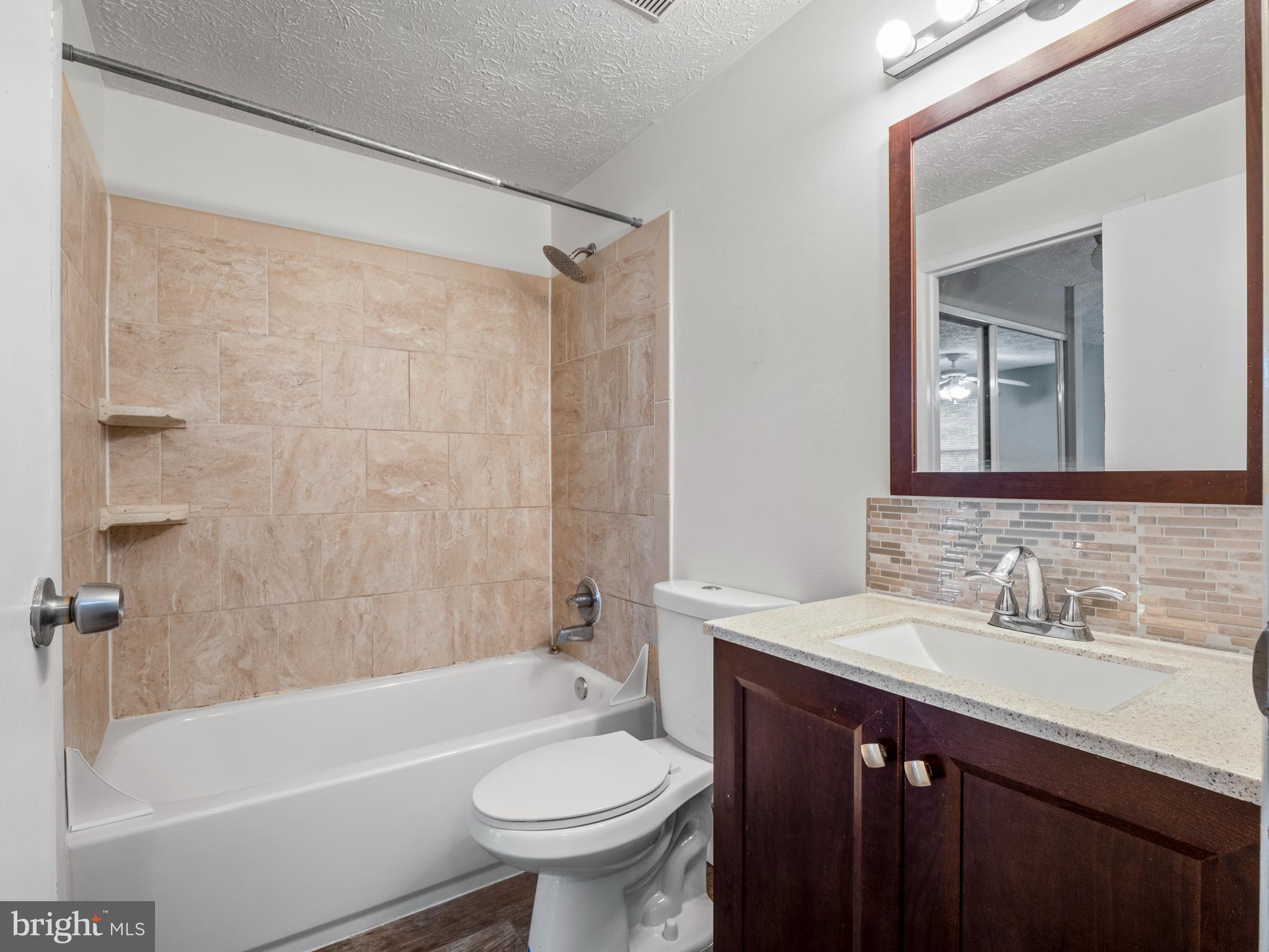 8315 Brookvale Court Springfield, VA 22153 - Photo 17 of 24 a bathroom with a sink and a mirror