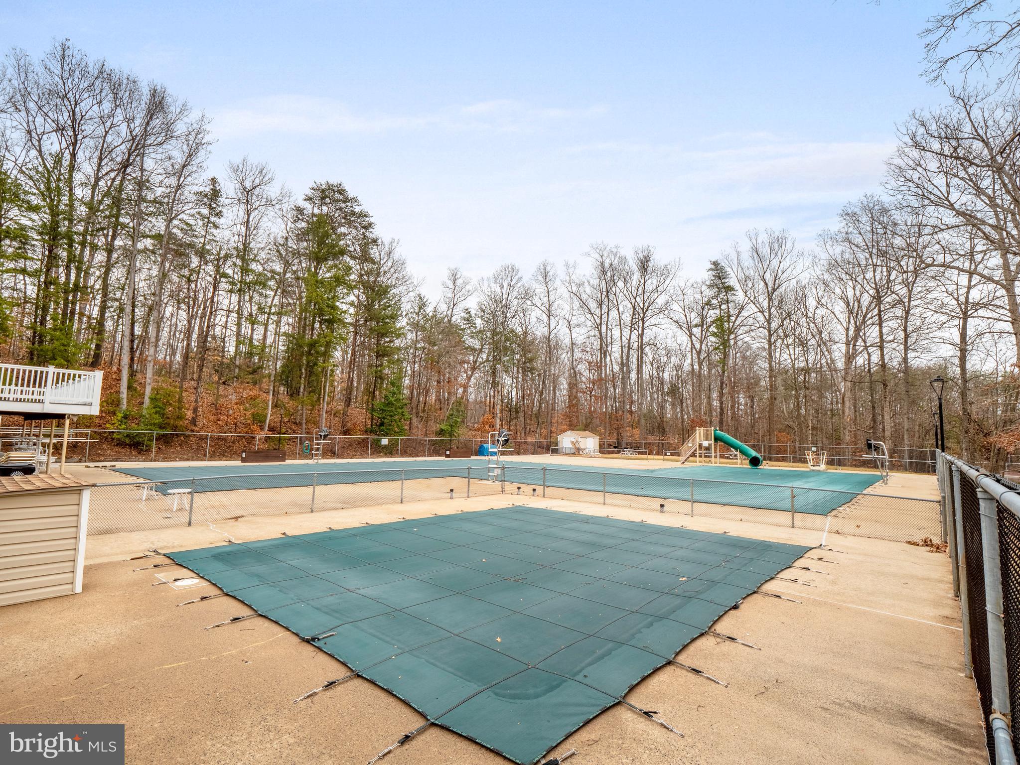 8315 Brookvale Court Springfield, VA 22153 - Photo 20 of 24 a view of a swimming pool with an outdoor space and seating area
