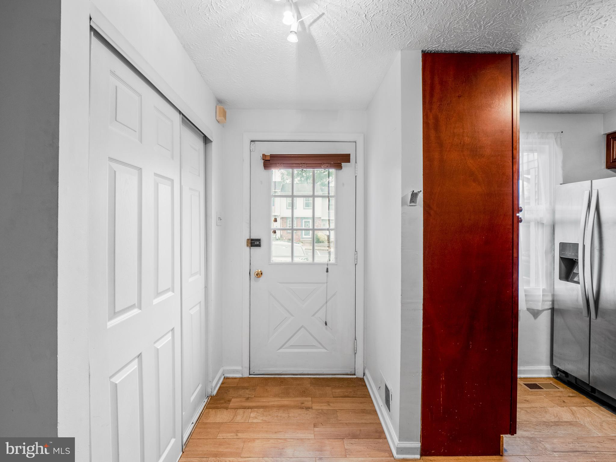 8315 Brookvale Court Springfield, VA 22153 - Photo 9 of 24 a view of a hallway with a dining room