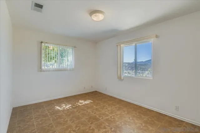 a bathroom with a sink mirror vanity and toilet