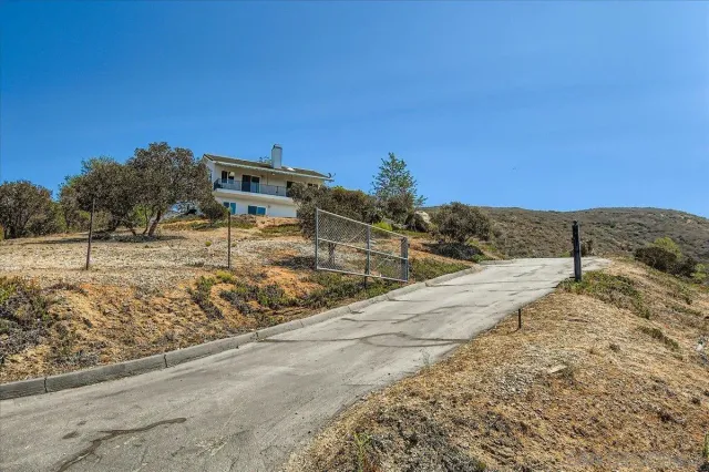 a view of a house with a mountain yard
