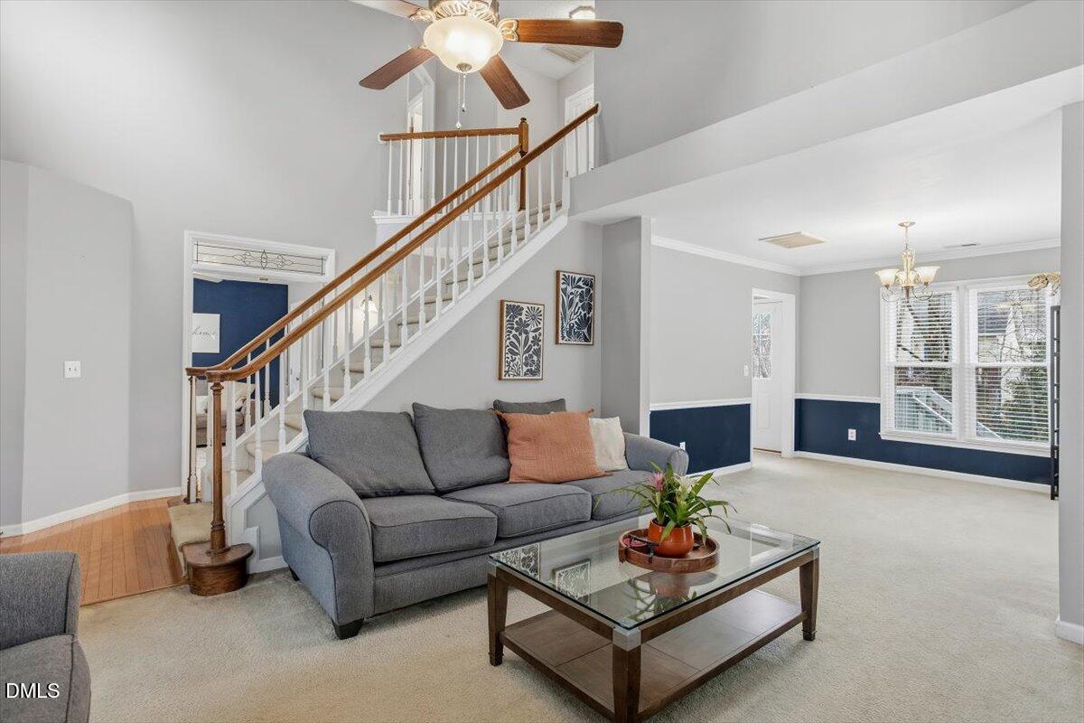 211 Kronos Lane Cary, NC 27513 - Photo 12 of 34 a living room with furniture and wooden floor