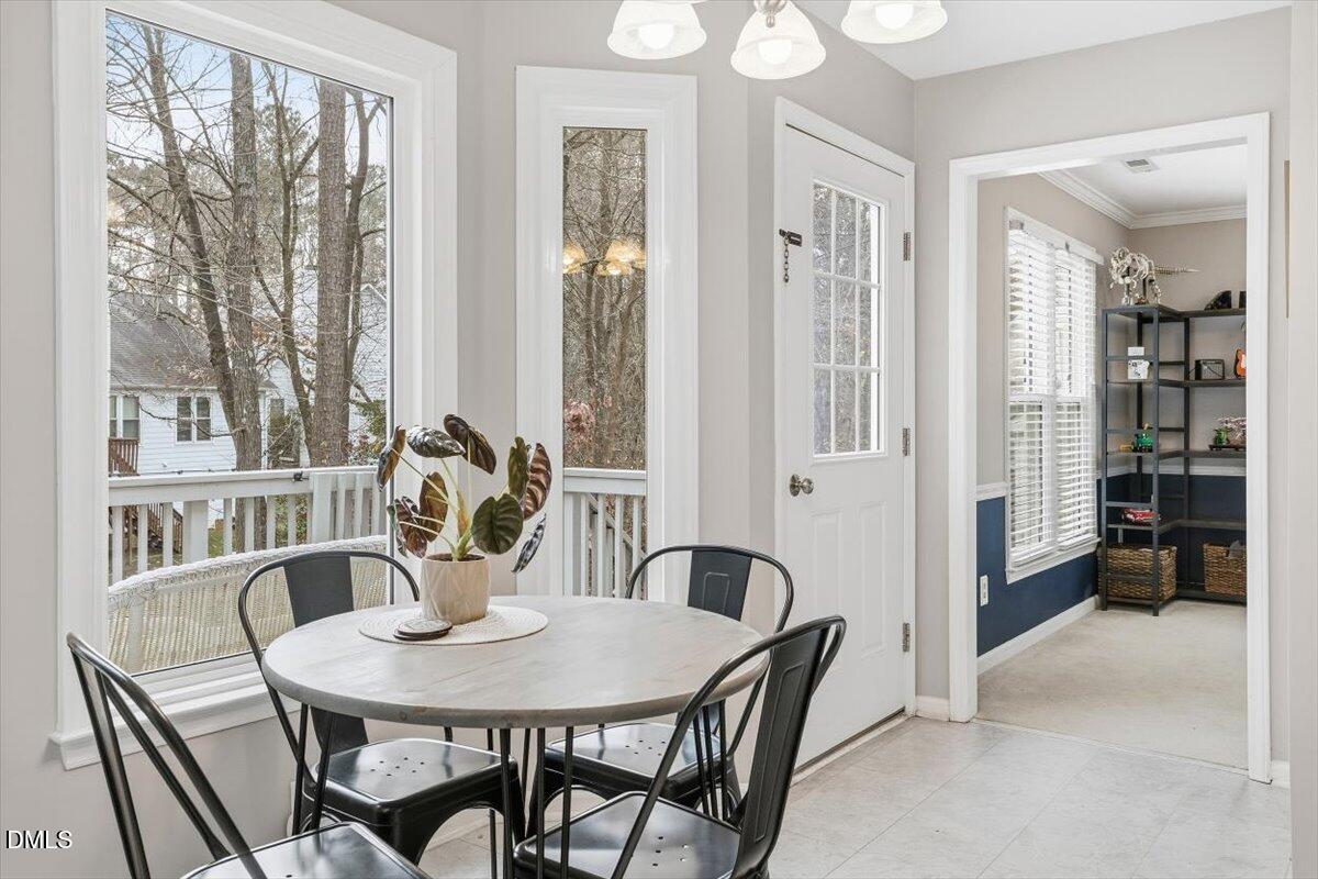 211 Kronos Lane Cary, NC 27513 - Photo 16 of 34 a view of a dining room with furniture window and outside view