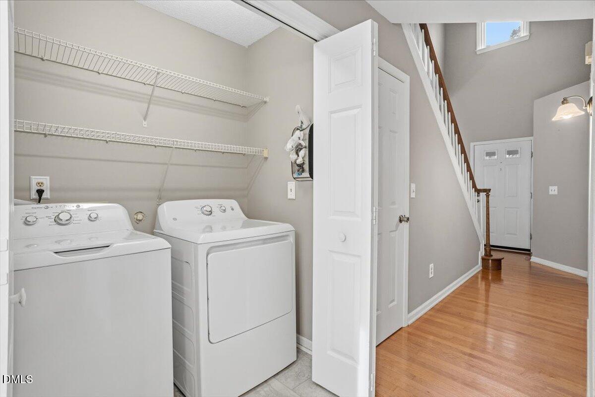 211 Kronos Lane Cary, NC 27513 - Photo 20 of 34 a view of storage and utility room with washer and dryer