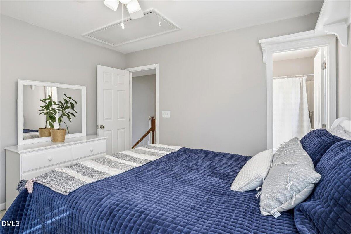 211 Kronos Lane Cary, NC 27513 - Photo 27 of 34 a bedroom with a bed and a window